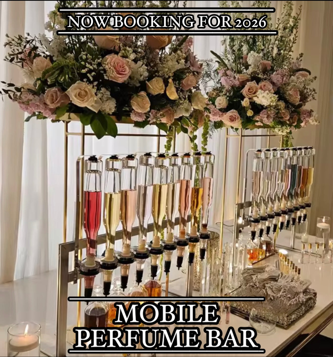 Mobile perfume bar setup with flowers and bottles on a table.